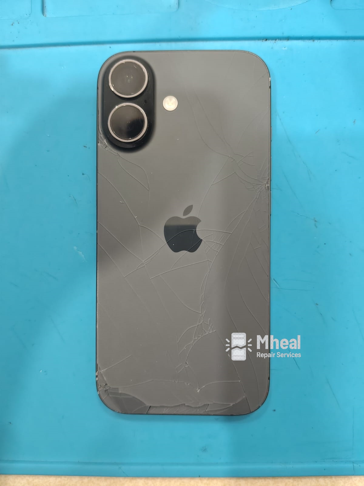 Damaged iPhone 16 back glass